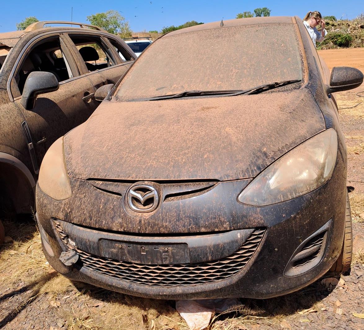 Black Mazda, no plates