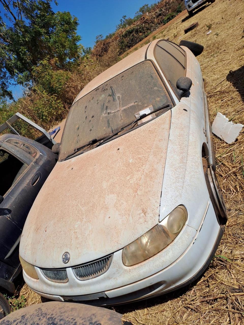 White Ford Falcon, no plates